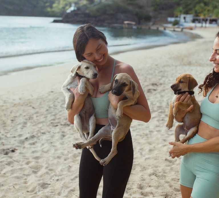 MacKenzie Hodge, Yoga Teacher at Galley Bay Resort and Spa with Dogs and Cats of Antigua Puppies in English Harbour
